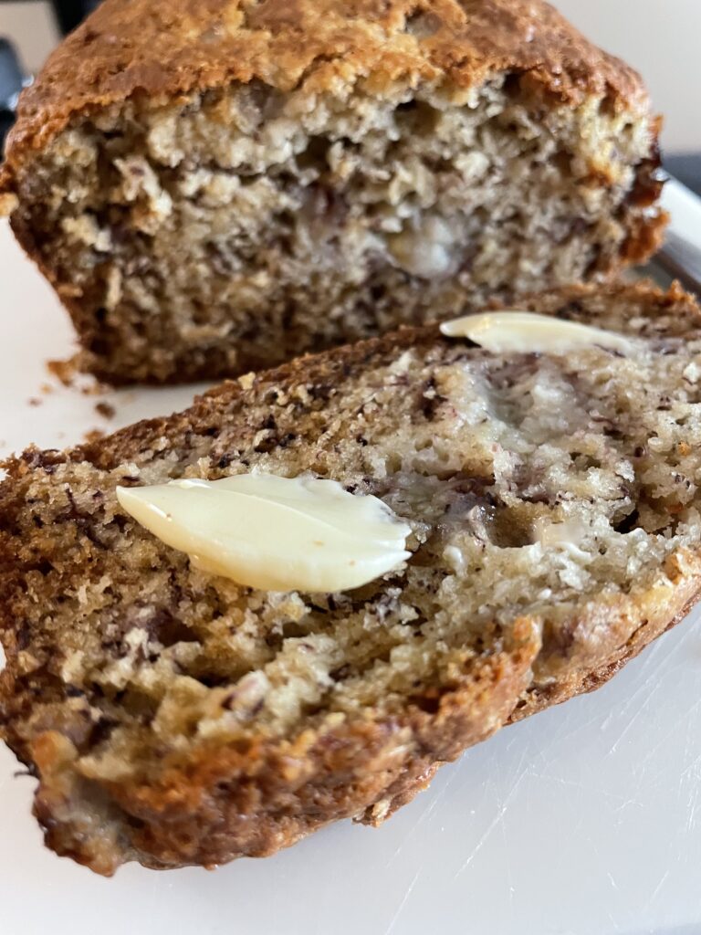 Banana Bread with a pab of butter metling.